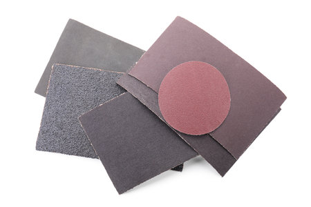 Many sheets of sandpaper isolated on white, top viewの写真素材