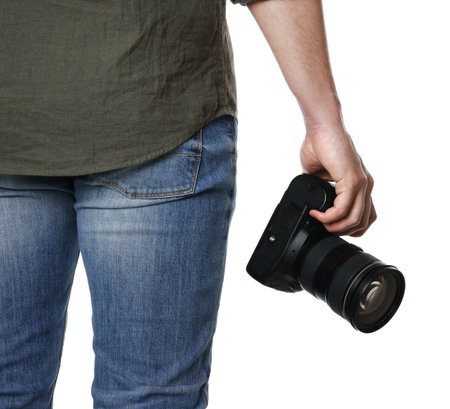 Photographer holding modern camera on white background, closeupの写真素材