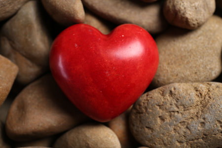 Red decorative heart on stones, above viewの写真素材