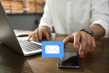 Email. Man taking smartphone to check message indoors, closeup. Incoming letter notification over...