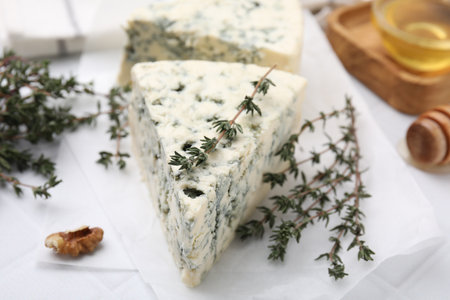 Tasty blue cheese with thyme on white table, closeupの写真素材