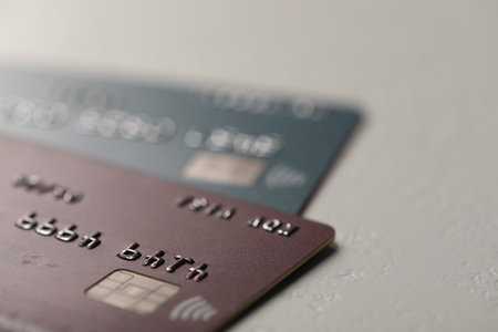Two credit cards on gray background, closeupの写真素材
