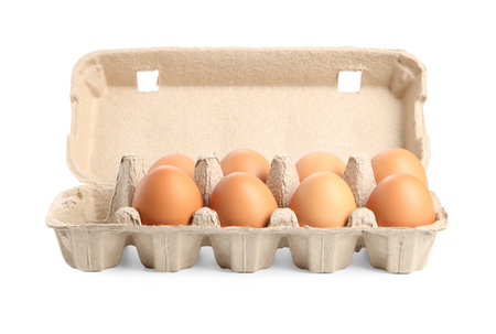 Chicken eggs in carton isolated on whiteの写真素材