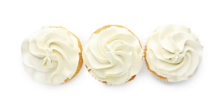 Tasty vanilla cupcakes with cream isolated on white, top viewの写真素材