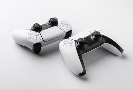 Wireless game controllers on light gray background