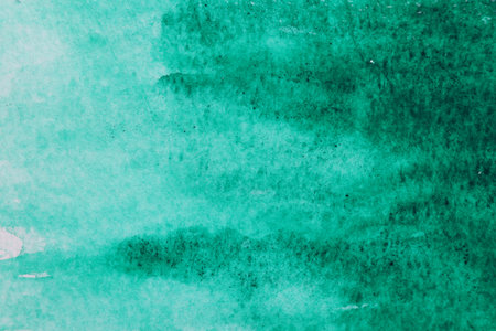 Abstract green watercolor painting as background, top viewの写真素材