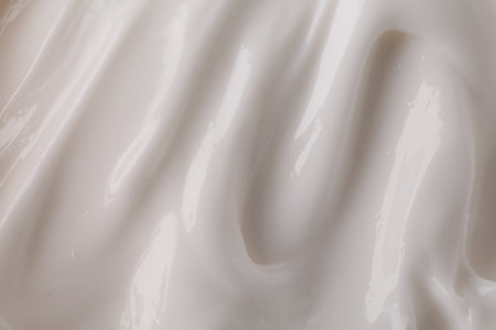 Texture of body care cream as background, top view