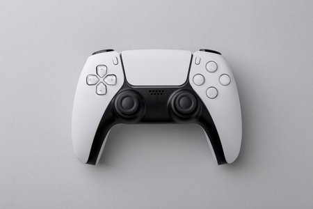 Wireless game controller on light gray background, top view