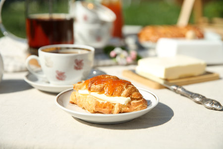 Beautiful table setting in garden on sunny day, closeupの写真素材