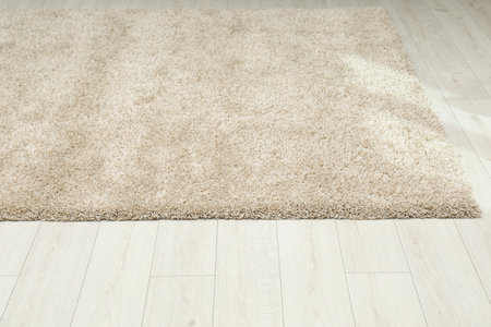 Soft beige carpet on white laminated floor indoorsの写真素材