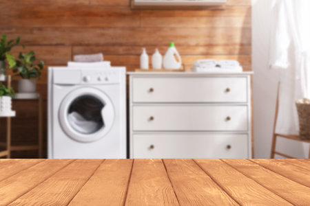 Empty wooden table in laundry room. Space for designの写真素材