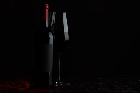 Tasty wine in glass and bottle on black background, space for textの写真素材