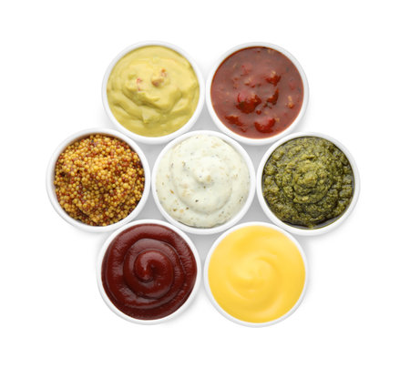 Many different sauces in bowls on white background, top viewの写真素材