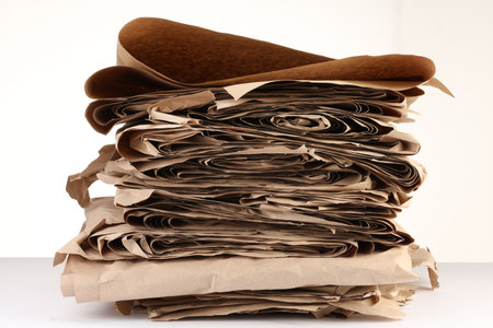 Stack of waste paper isolated on whiteの写真素材