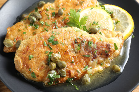 Delicious chicken piccata with herbs on table, closeupの写真素材