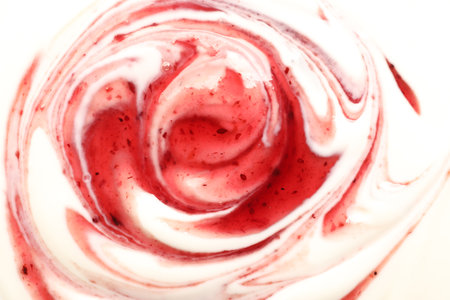 Tasty yoghurt with jam as background, top viewの写真素材