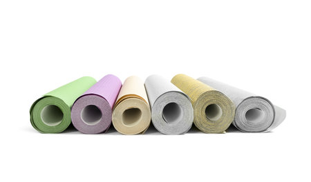 Different colorful wallpaper rolls isolated on whiteの写真素材