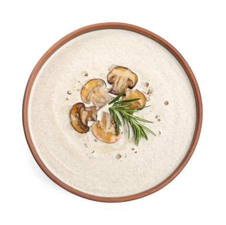 Fresh homemade mushroom soup in ceramic bowl isolated on white, top viewの写真素材