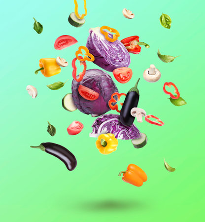Different fresh vegetables in air on green gradient backgroundの写真素材