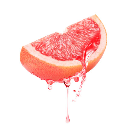 Fresh grapefruit with dripping juice on white backgroundの写真素材