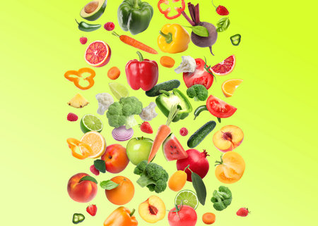 Different fresh fruits and vegetables in air on light green backgroundの写真素材