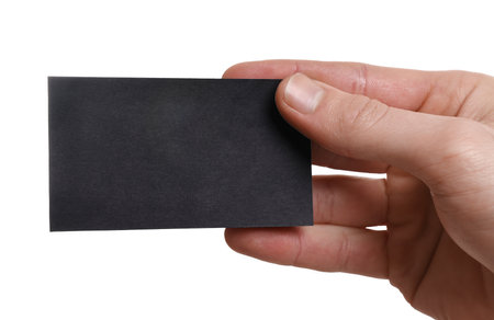 Man holding blank business card on white background, closeupの写真素材