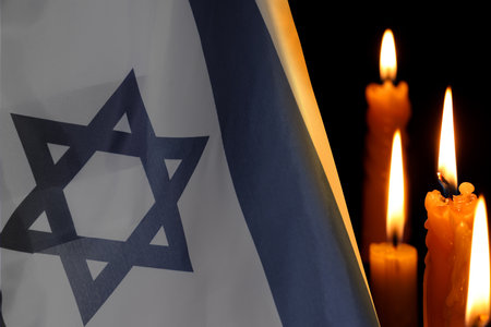 Holocaust memorial day. Flag of Israel and burning candlesの写真素材