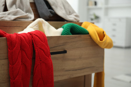 Cluttered chest of drawers indoors, closeup. Clothes in messの写真素材