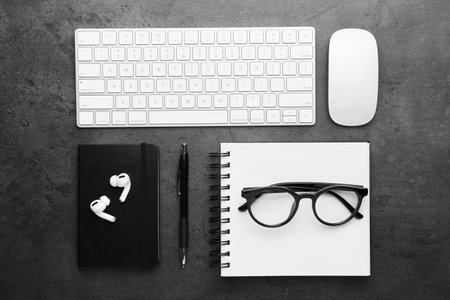 Flat lay composition with different office stationery on dark gray tableの写真素材