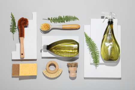 Flat lay composition with different cleaning supplies on light gray backgroundの写真素材