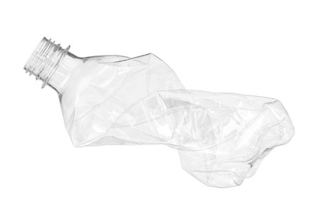 Crumpled disposable plastic bottle isolated on whiteの写真素材