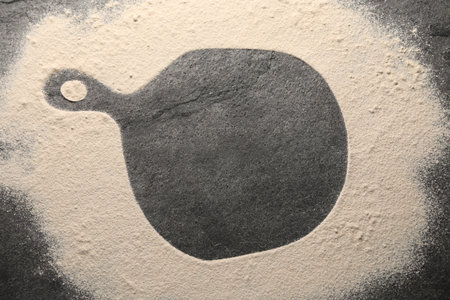 Imprint of board on gray textured table with flour, top viewの写真素材