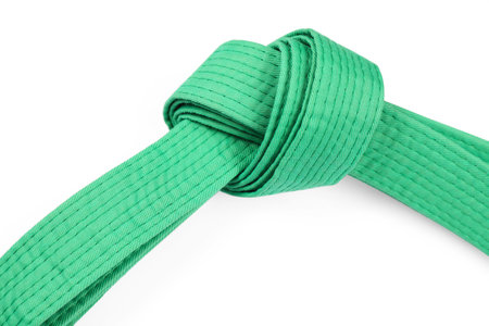 Green karate belt isolated on white. Martial arts uniformの写真素材