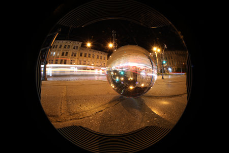 Crystal ball on asphalt road at night, wide-angle lensの写真素材
