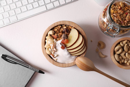 Flat lay composition with tasty granola on beige tableの写真素材