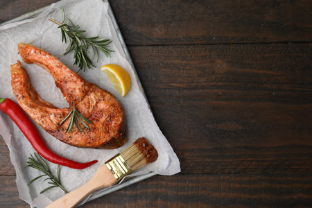 Fresh marinade, fish and other products on wooden table, top view. Space for textの写真素材
