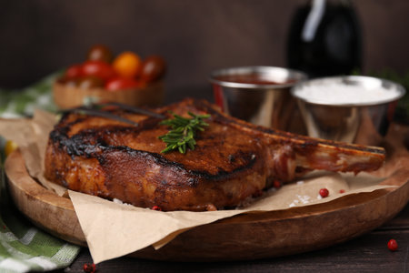 Tasty marinated meat, rosemary and spices on wooden table, closeupの写真素材