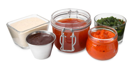 Different marinades in tableware isolated on white