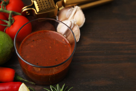 Tasty marinade and products on wooden table, closeup. Space for textの写真素材