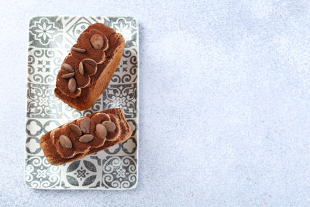 Tasty puff pastry. Supreme croissants with chocolate chips and cream on gray table, top view. Space for textの写真素材