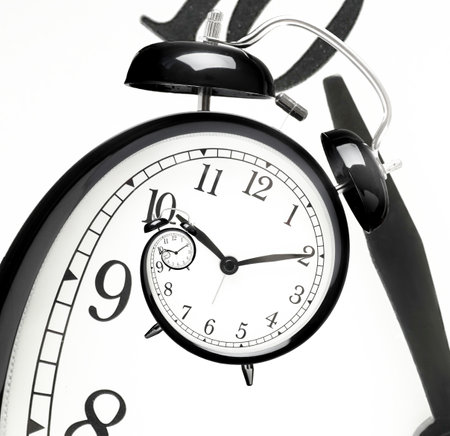 Infinity and other time related concepts. Alarm clock face twisted in spiral, fractal pattern
