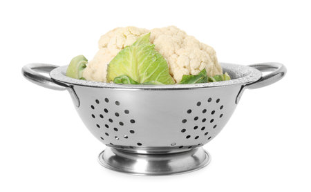 Metal colander with cauliflower isolated on whiteの写真素材