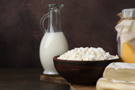 Dairy products. Different kinds of cheese and milk on wooden table, closeup. Space for textの写真素材