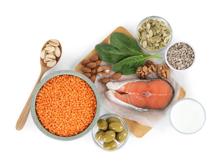 Different seeds and products high in healthy fats isolated on white, top viewの写真素材