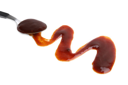 Spoon with fresh marinade isolated on whiteの写真素材