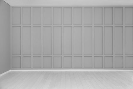 Empty room with gray wall and laminated floorの写真素材