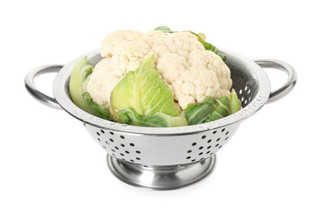 Metal colander with cauliflower isolated on whiteの写真素材