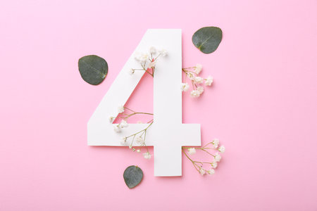 Paper number 4, gypsophila flowers and eucalyptus leaves on pink background, flat lay
