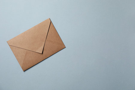 Letter envelope on gray background, top view. Space for textの写真素材