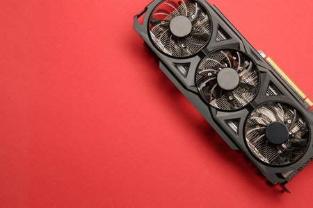 One graphics card on red background, top view. Space for textの写真素材